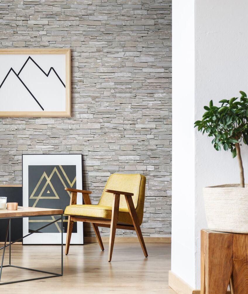 Living room setting with mountain picture frames in front of our natural dry stone wall panel